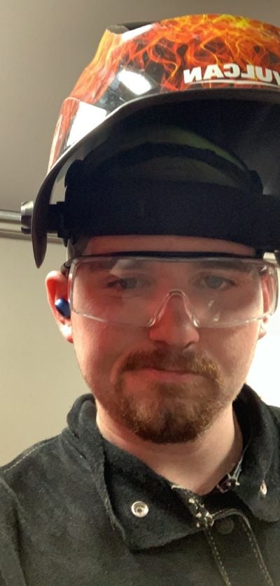 JT King in a welding helmet